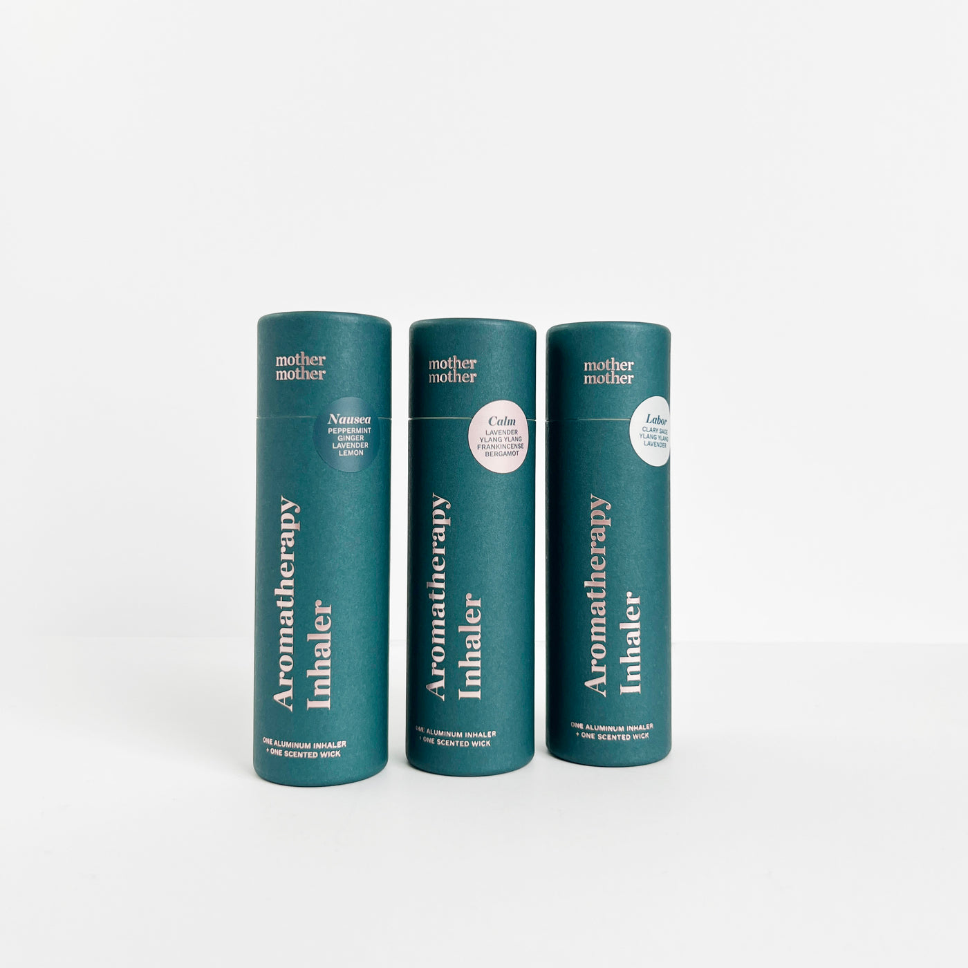three paper tubes with aromatherapy inhalers inside on a white background.